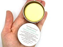 Load image into Gallery viewer, Peppermint lotion bar in tin in palm of hand